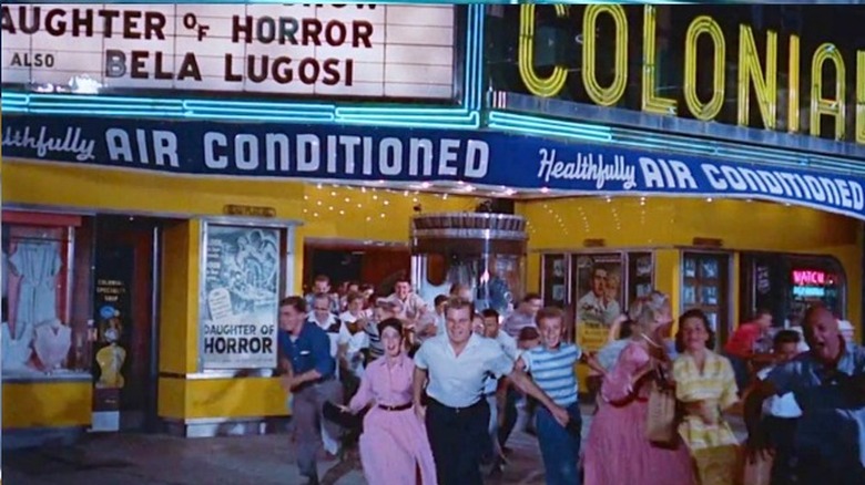 Audience rushing out of The Colonial Theatre in The Blob