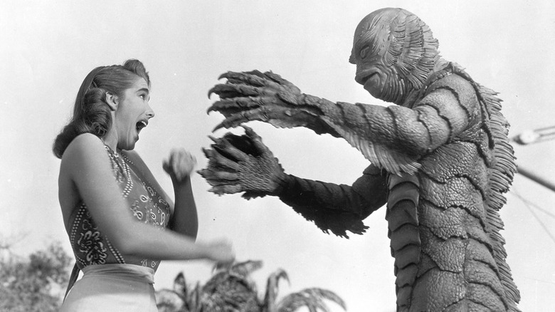 Gill-Man reaching for Kay