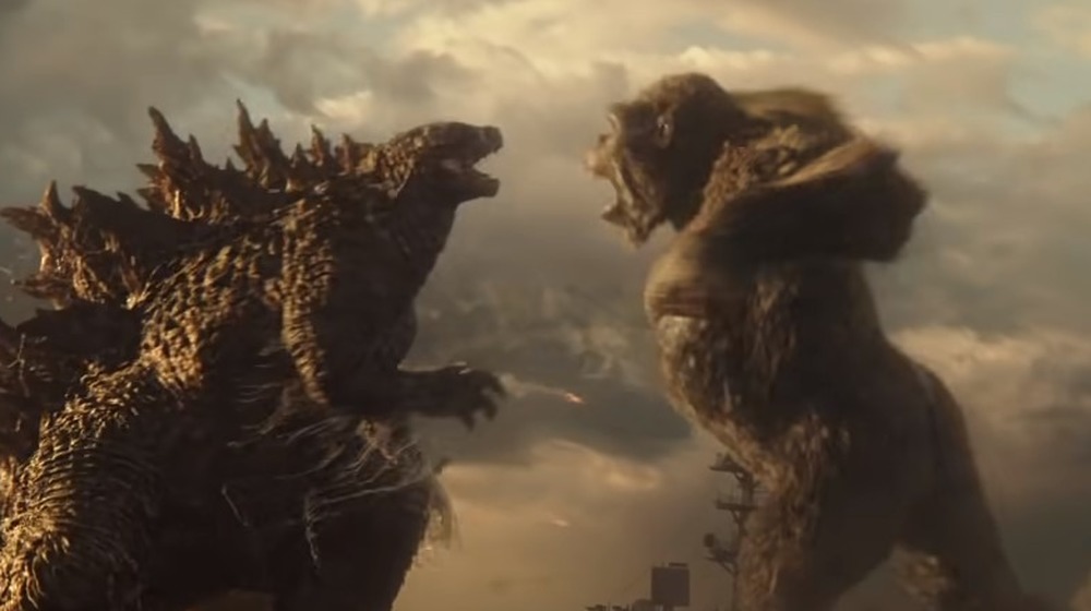 Godzilla and Kong fighting