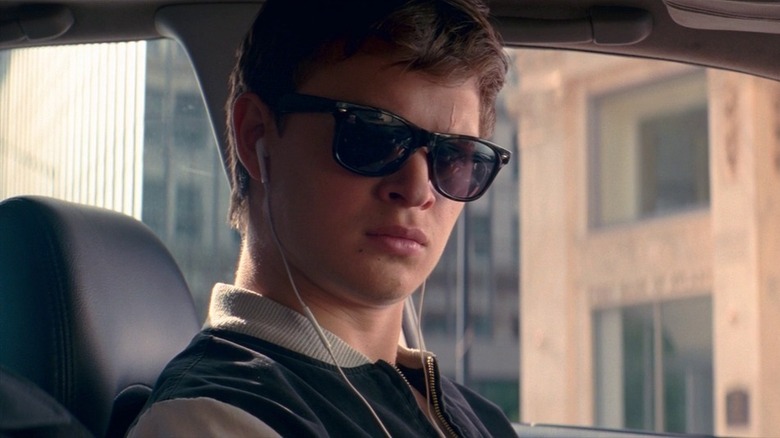 Baby in Baby Driver w/ headphones