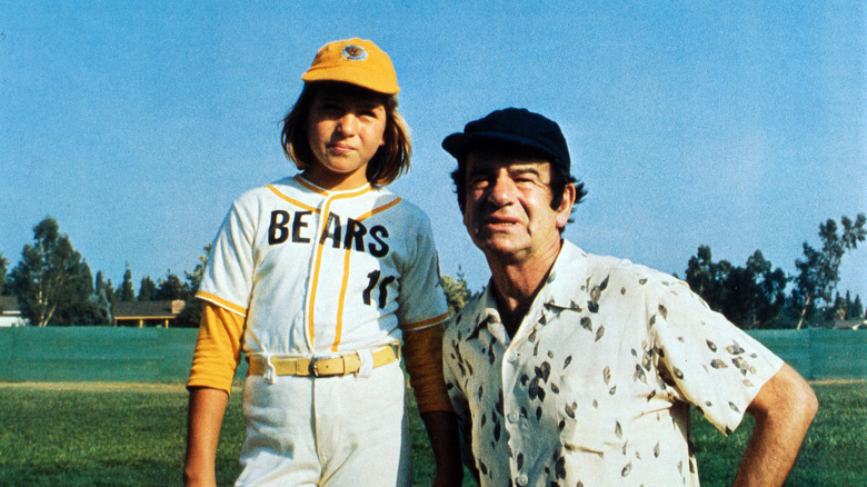 Tatum O'Neal and Walter Matthau on the field