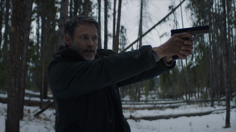 Stephen Moyer holding a gun 