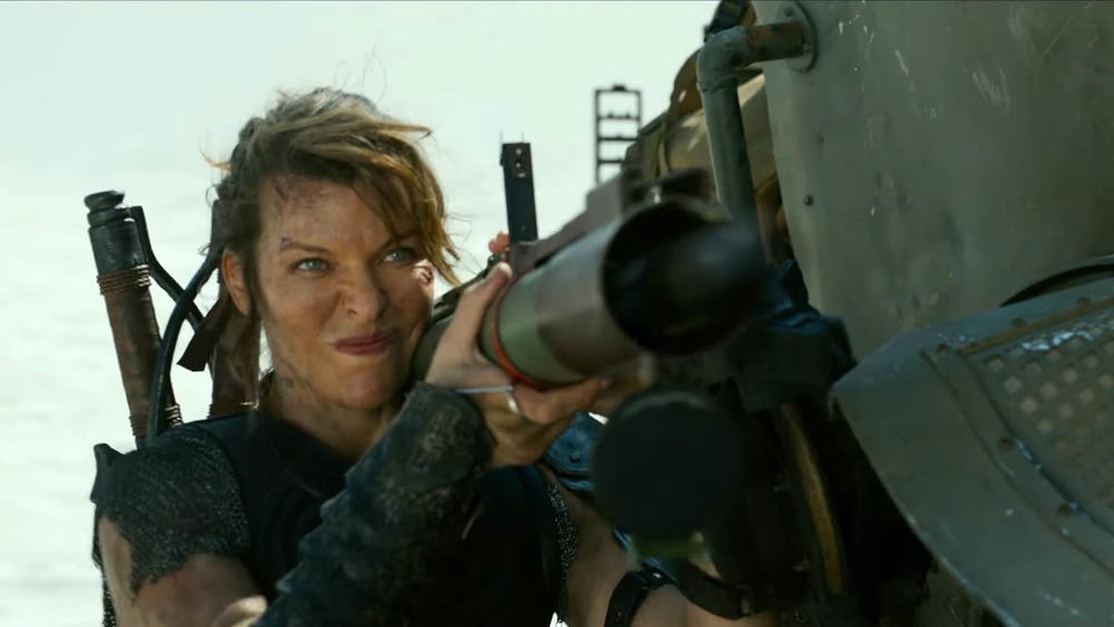 Milla Jovovich holding big gun