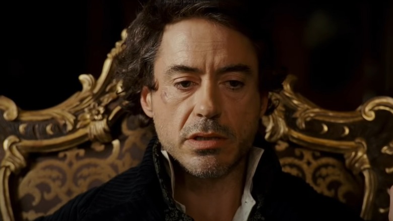 Robert Downey, Jr. as Sherlock Holmes looking dazed