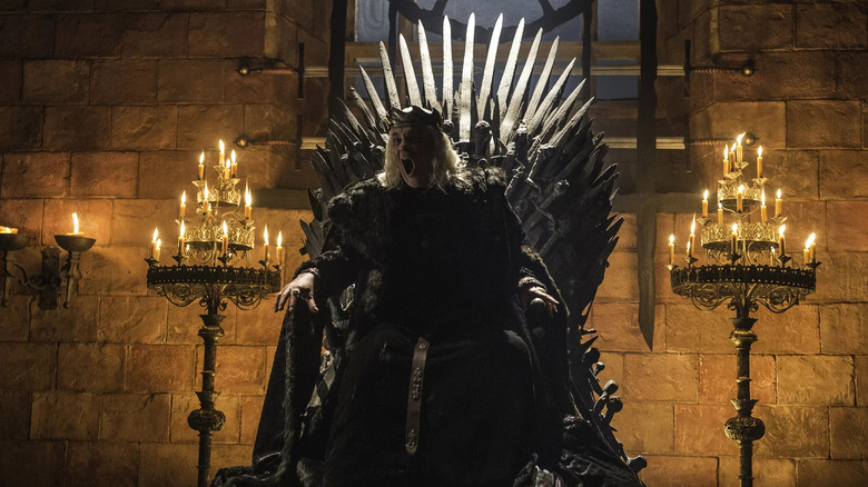 Mad King Aerys II sits the throne