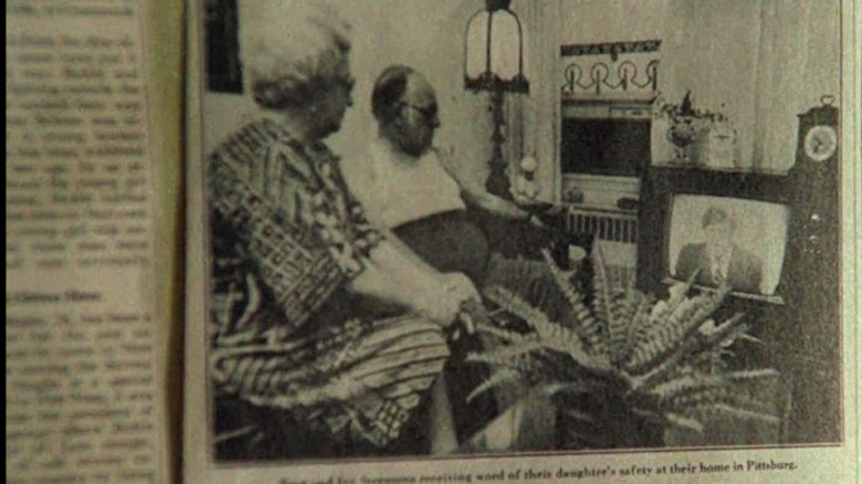 Charles Scorsese (r), in a photo, watches a television news broadcast