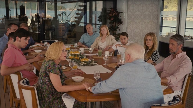 The cast of Succession sitting around a table