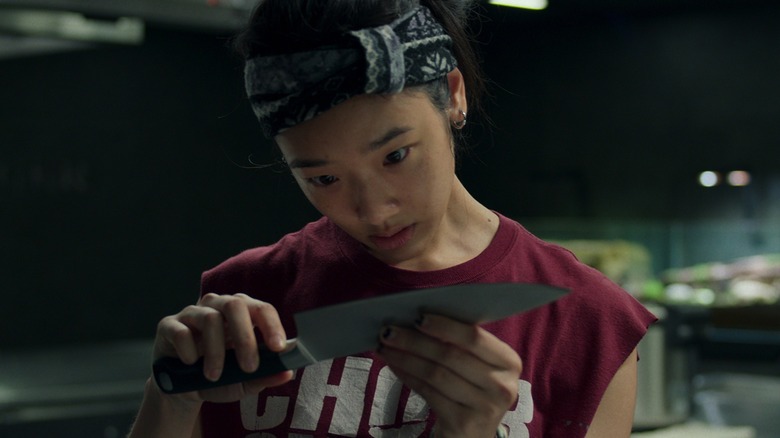 Aoy gazing at her knife