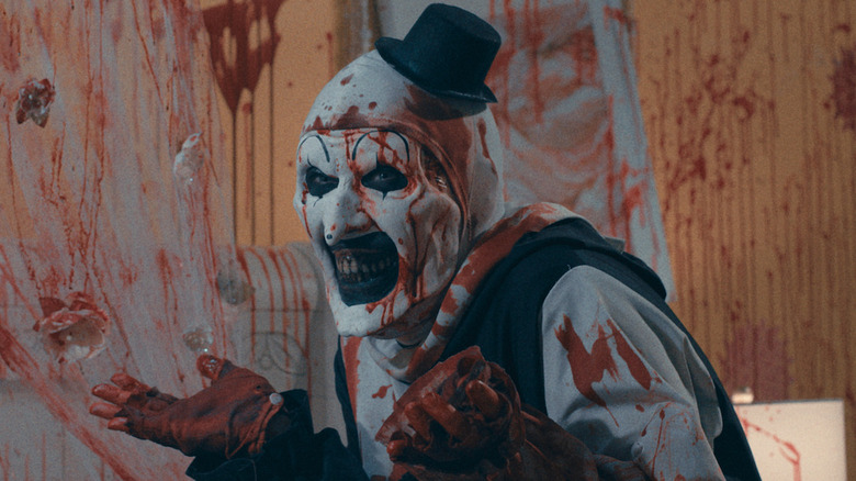 Art the Clown giggles among gore in "Terrifier 2"