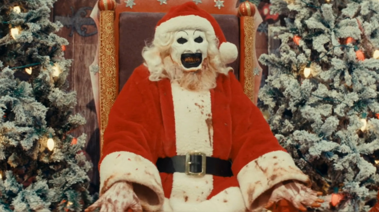 Art grinning as Santa Claus