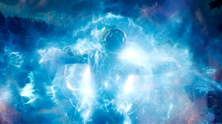 Carol Danvers is blasted by blue energy waves from the Tesseract