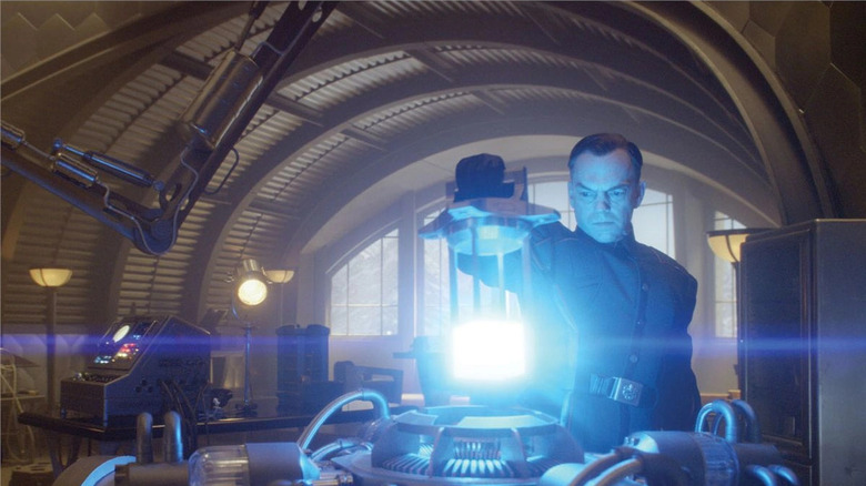 Schmidt uses the Tesseract surrounded by lab equipment