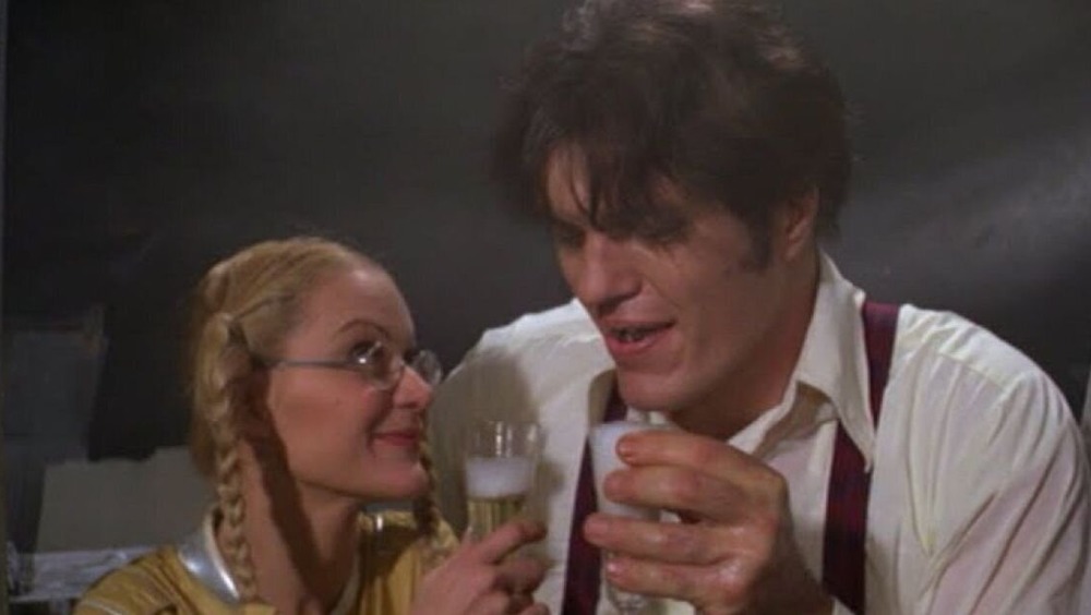 Richard Kiel as Jaws with Blanche Ravalec as Dolly, toasting in Moonraker