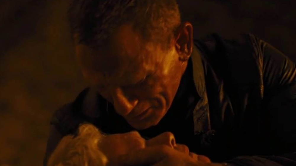 Daniel Craig as James Bond weeps over Judi Dench as M in Skyfall