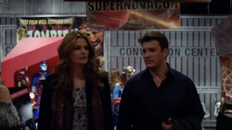 Beckett and Castle talking at a comic convention