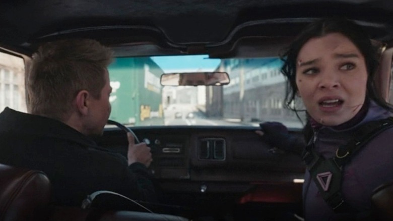 Clint Barton driving and Kate Bishop worried