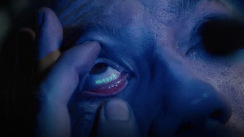 Hand holding replicant eye open
