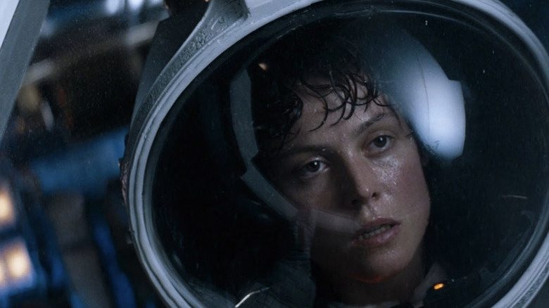 Ripley in a space helmet sweating and exhausted in Alien