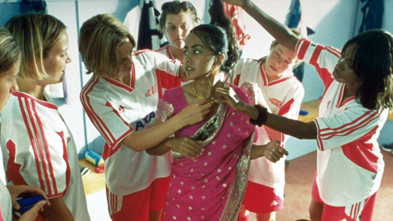 Girls soccer team dressing Jess in a sari in Bend it Like Beckham