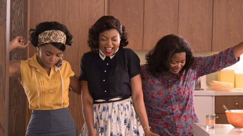 Mary Katherine and Dorothy dancing in a kitchen and celebrating in Hidden Figures