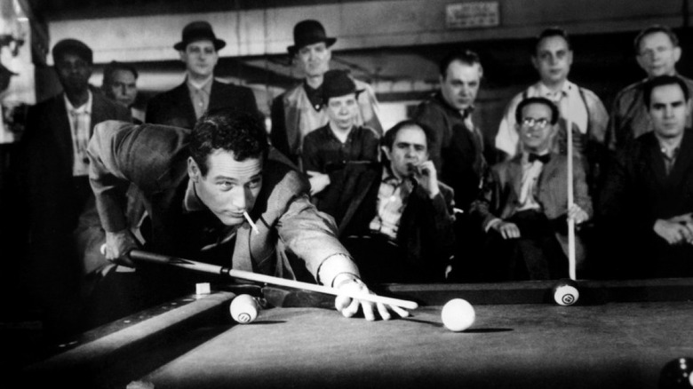 Paul Newman plays pool in The Hustler