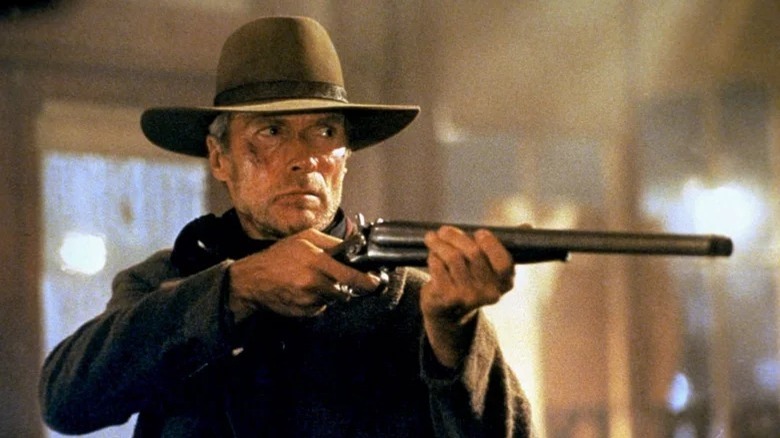 Clint Eastwood aims rifle