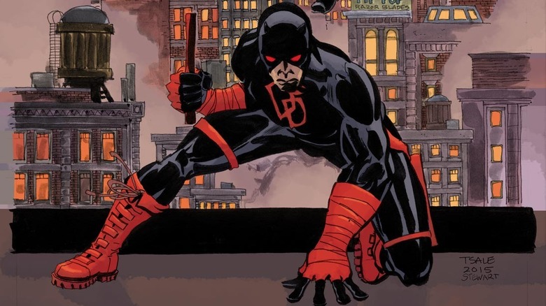 Daredevil striking a superhero pose on a rooftop