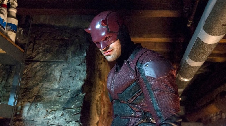 Daredevil wearing his darker red suit