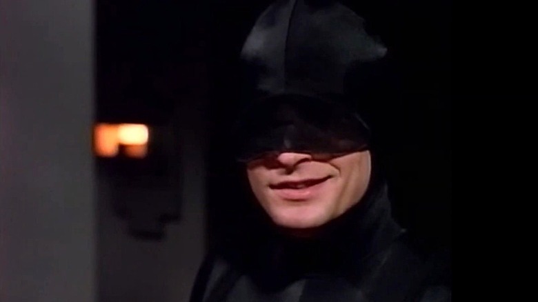 A smiling Daredevil wearing his all-black costume