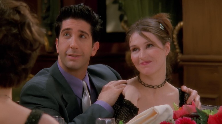 Ross Geller places his hands on Emily's shoulders