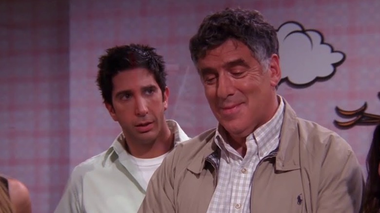 Jack Geller smiles as Ross Geller watches