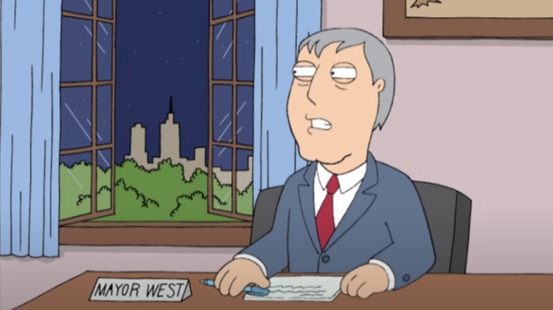 Mayor West looking through window