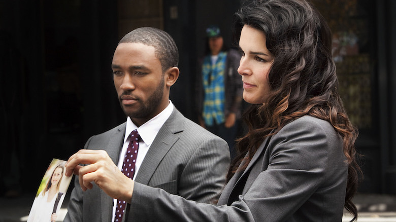 Barry Frost and Jane Rizzoli holding a picture