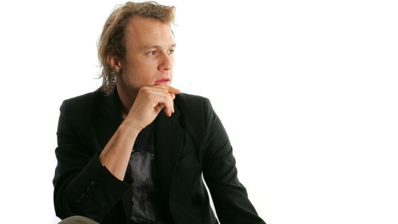 Heath Ledger looking off to the side