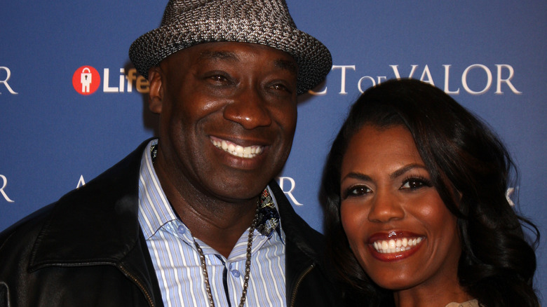 Michael Clarke Duncan and Omarosa Manigault smiling