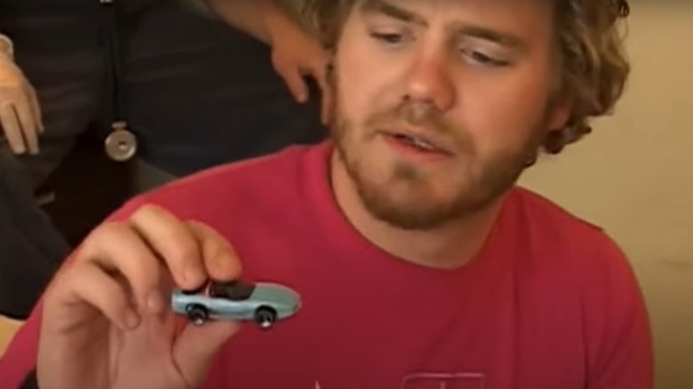 Ryan Dunn with toy car