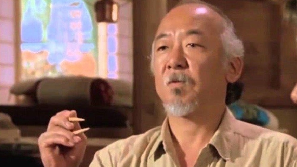 Mr. Miyagi holding chopsticks