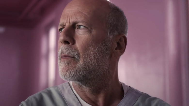 Bruce Willis in pink room