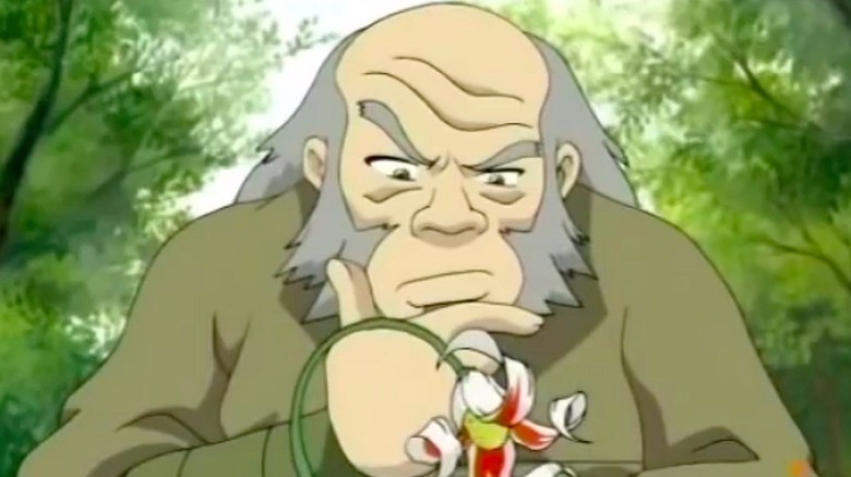 Uncle Iroh inspects a flower