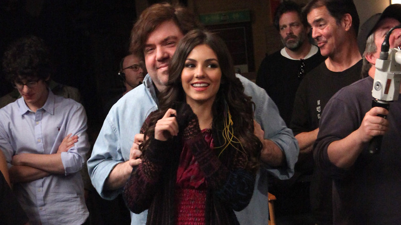 Dan Schneider holding Victoria Justice