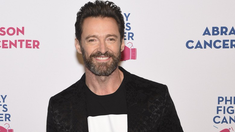 Hugh Jackman smiles at charity