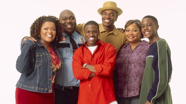 The cast of "The Big House" smiling with a white background