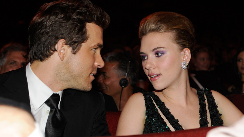 Ryan Reynolds talking to Scarlett Johansson