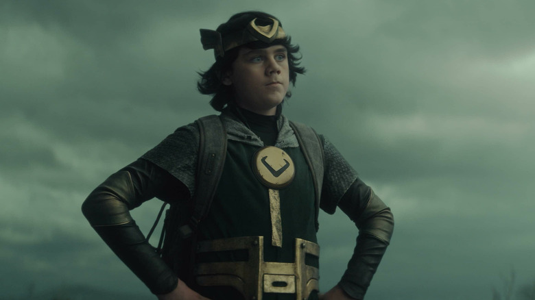 Kid Loki standing with hands on hips on Loki