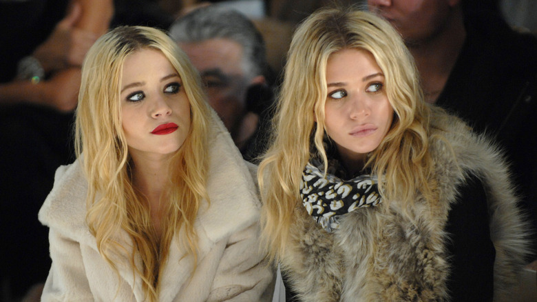 Mary-Kate and Ashley watching runway