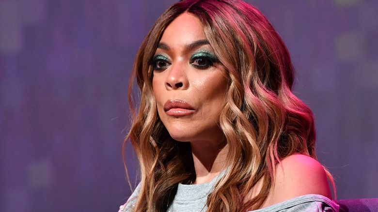 Wendy Williams looking sad against a purple background