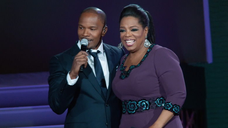 Jamie Foxx and Oprah Winfrey smiling