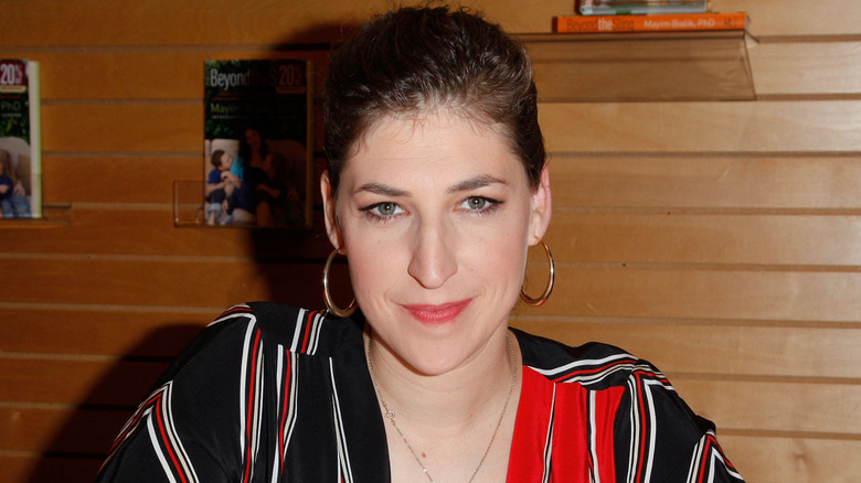 Mayim Bialik signing a book