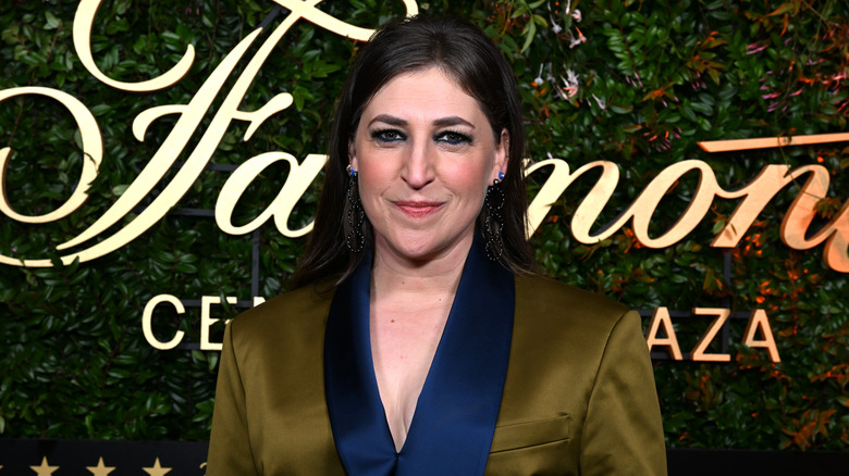 Mayim Bialik wearing green suit