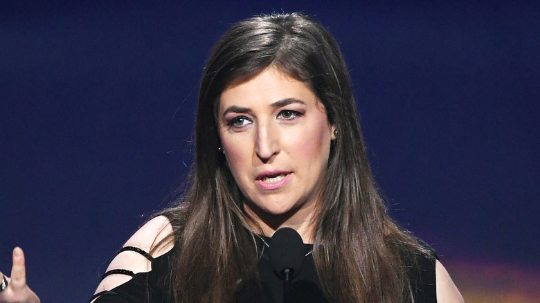 Mayim Bialik holding an award